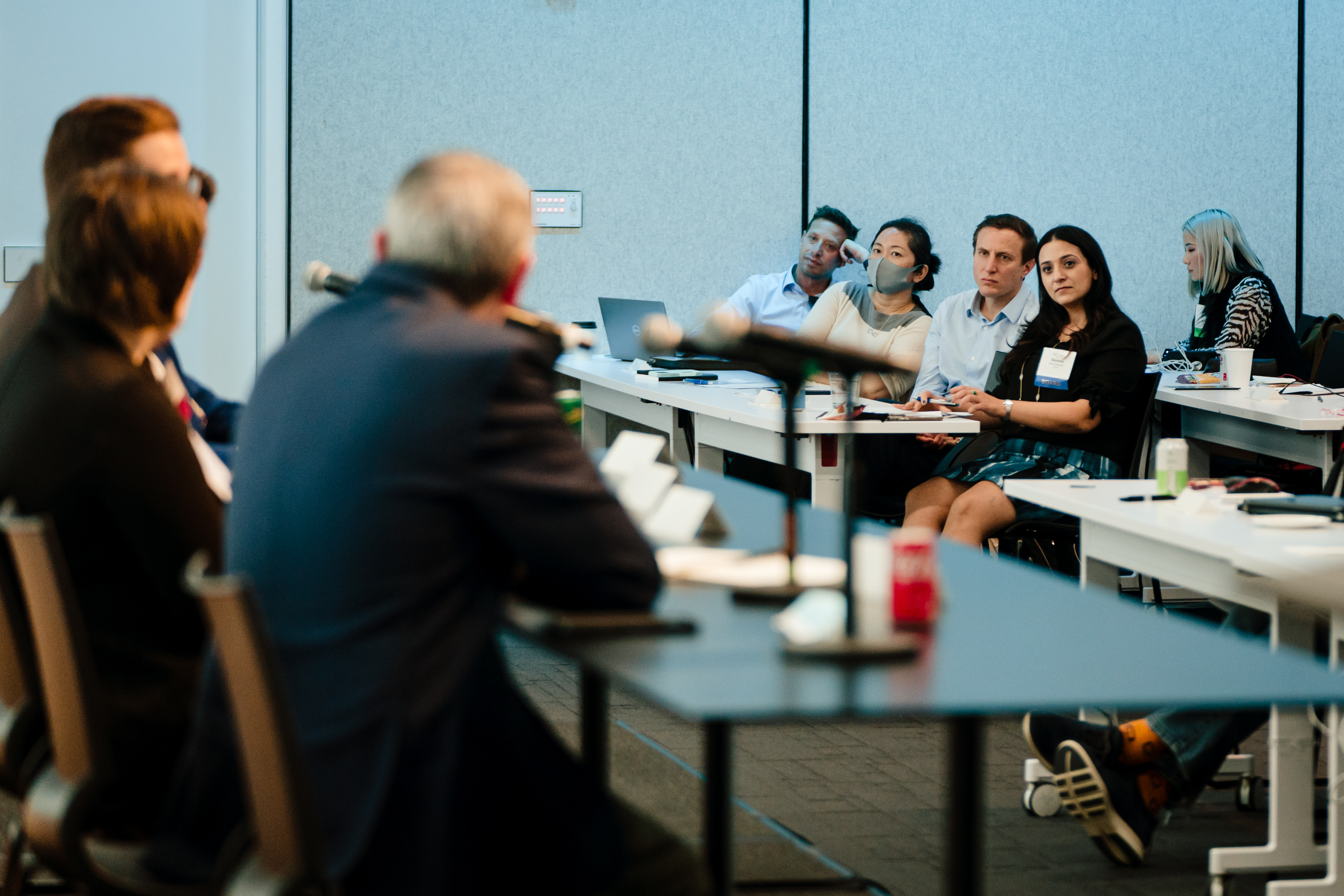 Engaged audience members looking at panelists.