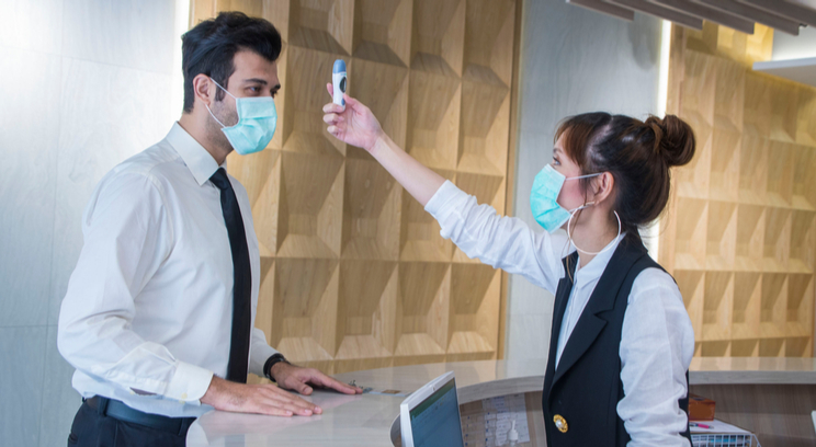 COVID temperature check in an office