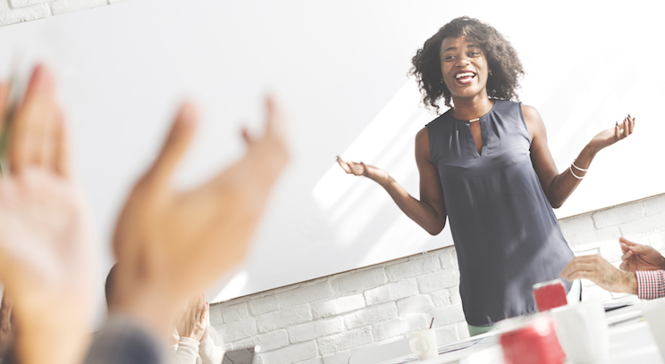 a woman giving a presentation