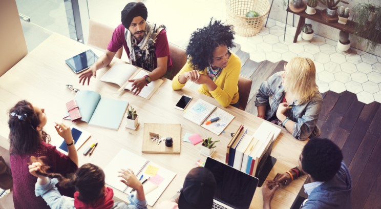 a diverse group of business people around a table