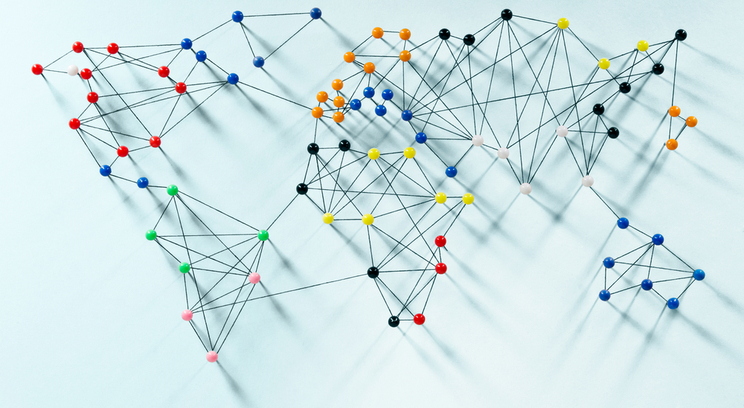 a map of the world made of push pins and string