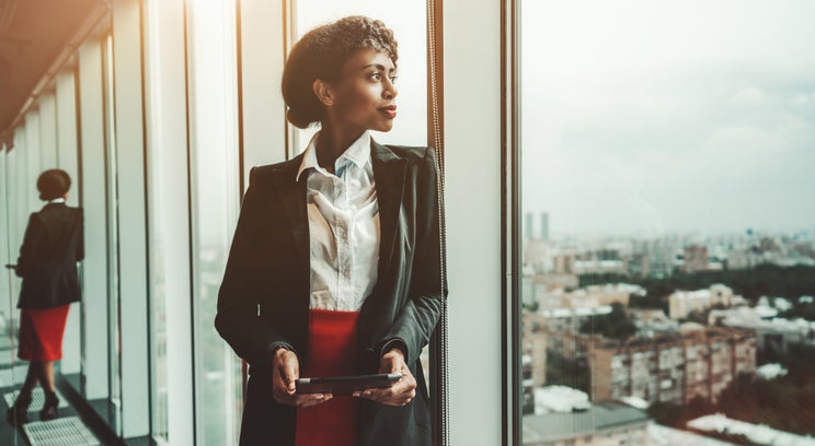 Business woman looking out a window