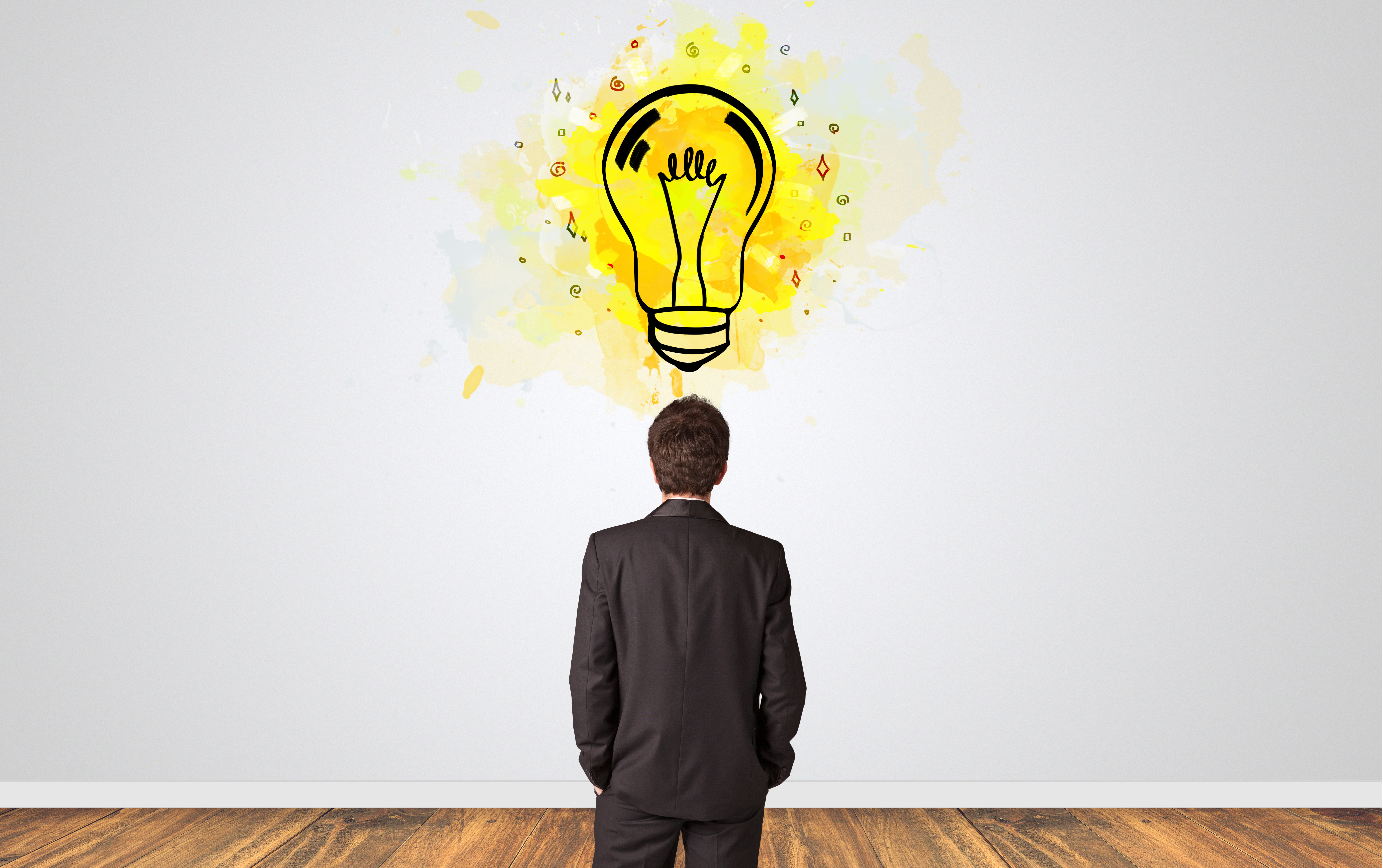 Businessman looking to a wall with new idea concept.