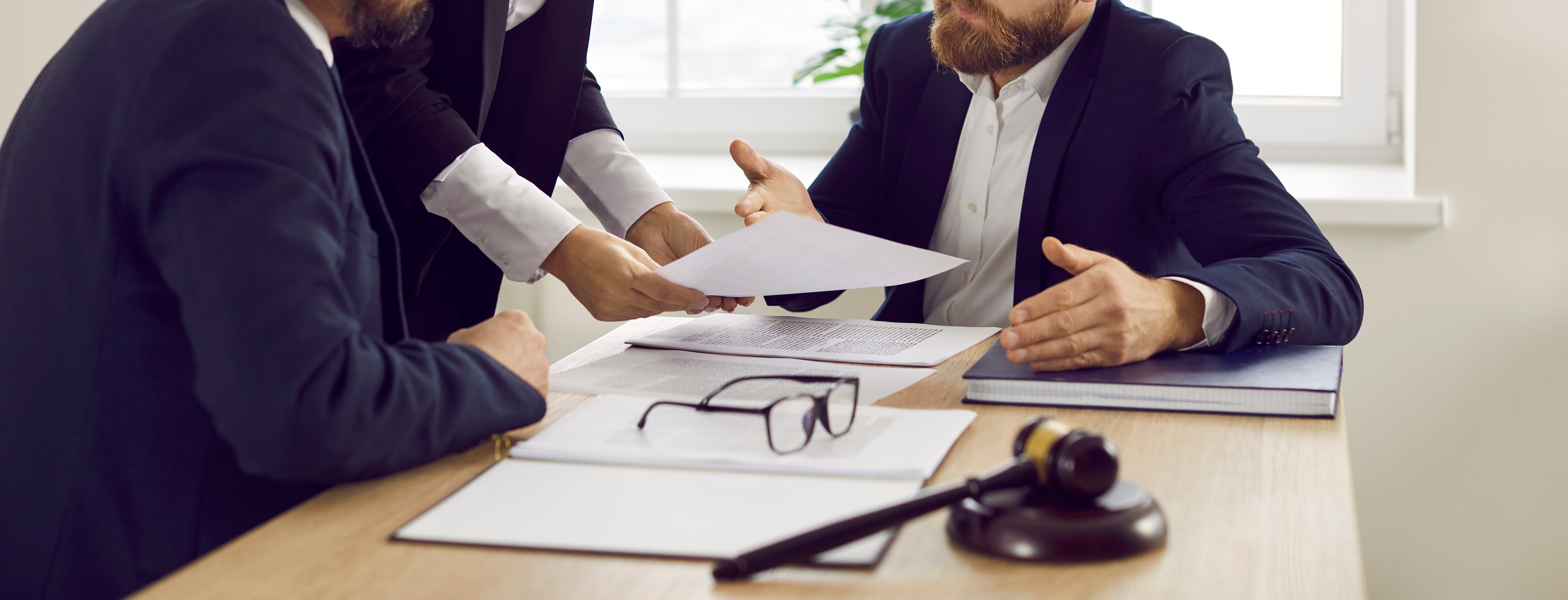 Lawyers conversing with one another.