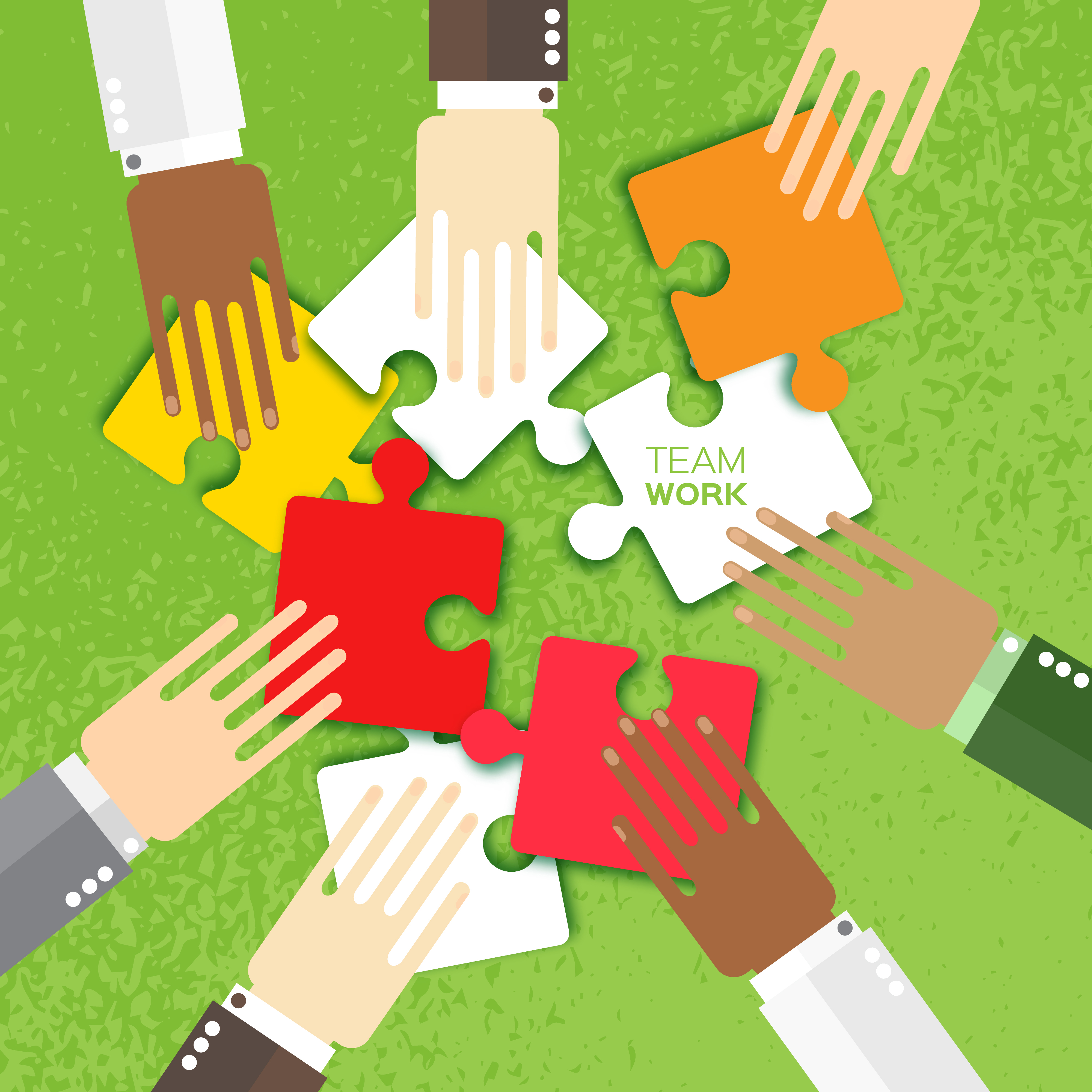 Different shades of hands using team work to piece a puzzle together.
