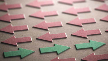 a few green arrows pointed right while many red arrows are pointed left