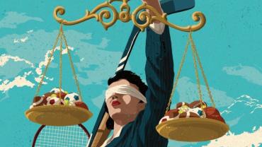 Justice figure holding scales with sports balls on them