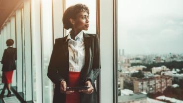 Business woman looking out a window
