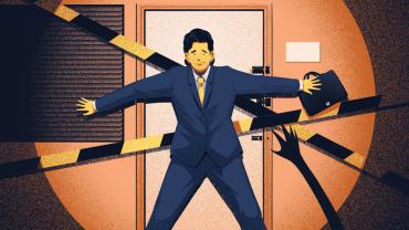 man in a suit holding a door shut and facing a spotlight and reaching hands