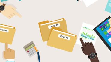 Several hands pointing at folders labeled Vendor and other objects on a table.