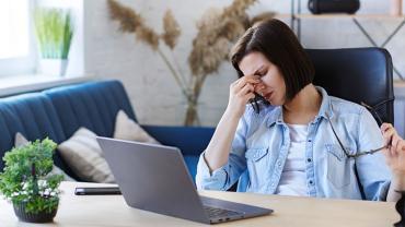 a stressed woman working from home 
