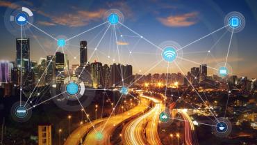 city lit up at night with a network of lights connecting various hubs