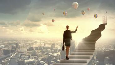 woman holding a briefcase walking up floating stairs above a city landscape