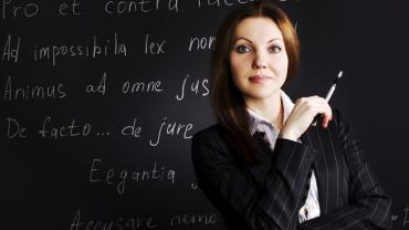 woman standing in front of a chalk board