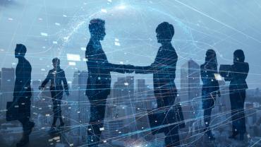 silhouettes shaking hands