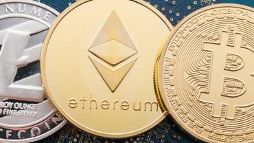 Golden tokens of digital cryptocurrencyies Bitcoin, Ethereum, Litecoin