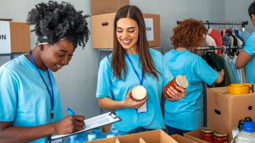 Volunteers assembling care packages