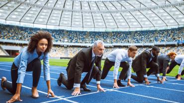 Businesspeople preparing to race