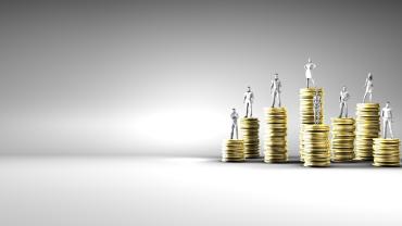 piles of gold with figurines on top looks like different genders