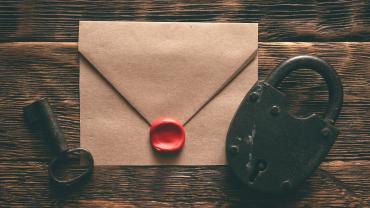 envelope with seal wax on, key on one side, lock on another -- to symbolize legal privilege