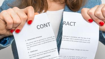 woman ripping up a contract