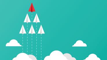 Six planes soaring through the clouds with one red leader at the front. 