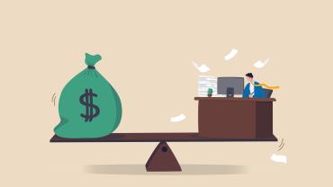 see saw with money bag with dollar sign on one end and desk with person working, papers flying, on other