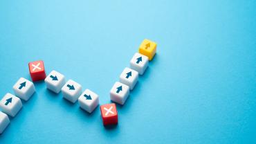 Symbol for failure as growth with a series of arrows pointing upward in succession.