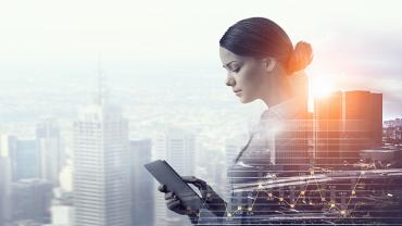 a business woman holding a tablet