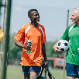Older men finishing soccer game