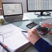 A person working on an invoice