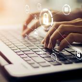 finger typing on a computer keyboard. lock symbols are shown