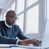 Man typing on laptop