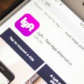 photo of car sharing app Lyft on a cell phone screen
