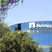 photo of NetApp headquarters building façade framed by trees