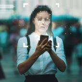 Women on phone, face pixelated