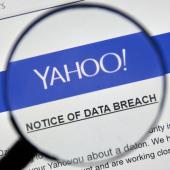 magnifying glass hovers over a document which reads: "Yahoo! Notice of Data Breach"