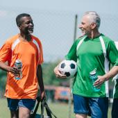 Older men finishing soccer game