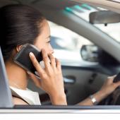Woman taking a work call from her car