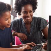 Teacher helping student