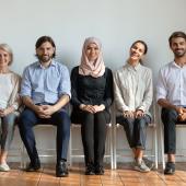 people sitting, dressed biz cas, mixed age, race, and gender