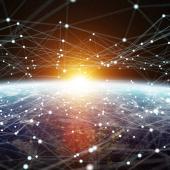 sun peaking over earth from space