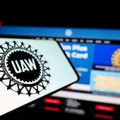 UAW worker's strike logo on a phone. 