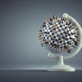 globe with chess pieces sticking menacing out from it