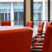 empty conference room table and chairs